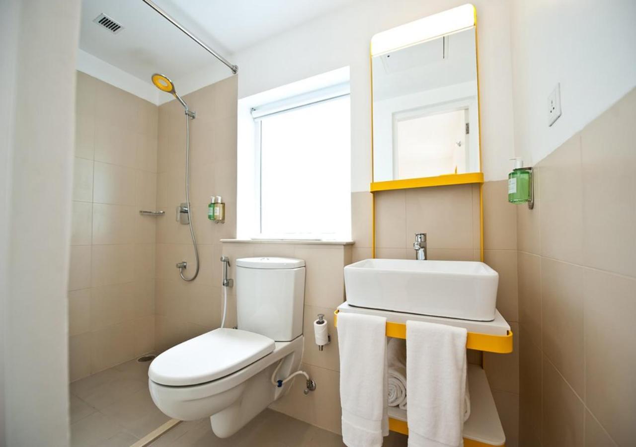 Bloom Hotel - Calangute Phòng bức ảnh